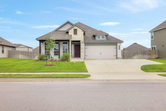 1925 Viva Rd, Bryan, TX 77807 - view of front of property featuring concrete driveway, an attached garage, stone siding, and brick siding