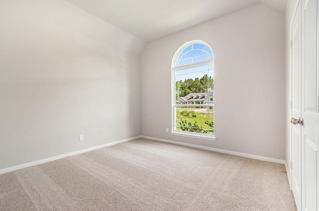 1284 Rd 66112, Dayton, TX 77535 - empty room featuring vaulted ceiling and light colored carpet