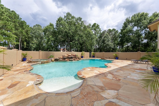 27514 Siandra Creek Ln, Spring, TX 77386 - view of swimming pool with a fenced backyard, a pool with connected hot tub, a patio area, and view of wooded area