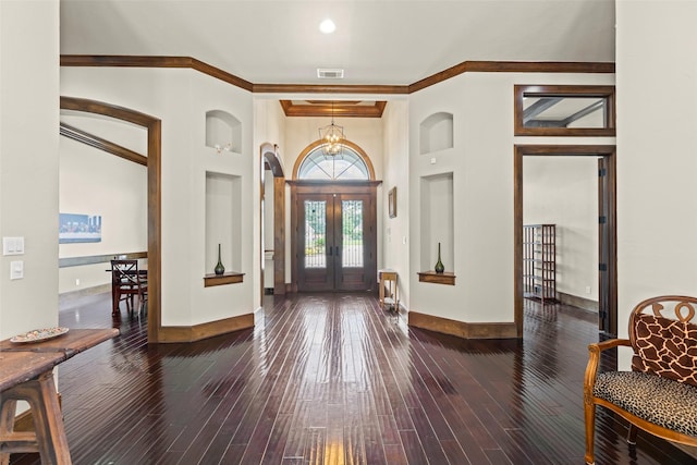 27514 Siandra Creek Ln, Spring, TX 77386 - foyer featuring french doors, crown molding, a high ceiling, wood-type flooring, and arched walkways