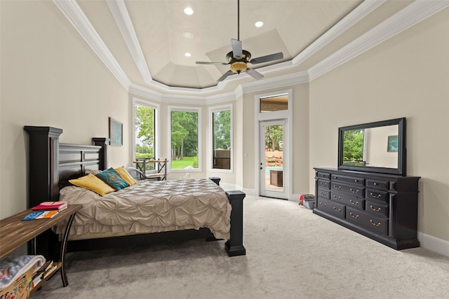 27514 Siandra Creek Ln, Spring, TX 77386 - carpeted bedroom with multiple windows, ornamental molding, access to exterior, a raised ceiling, and recessed lighting