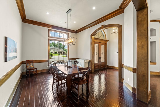 27514 Siandra Creek Ln, Spring, TX 77386 - dining space with crown molding, a chandelier, arched walkways, wood-type flooring, and recessed lighting