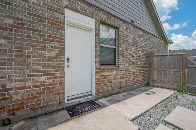 7702 Kenora Way, Richmond, TX 77407 - view of exterior entry featuring brick siding