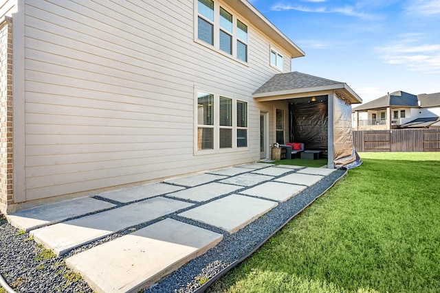 7702 Kenora Way, Richmond, TX 77407 - rear view of house featuring a patio area and roof with shingles