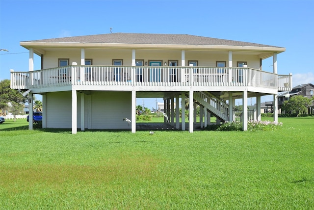 960 Alberdie Dr, Crystal Beach, TX 77650 - rear view of property with a lawn and a shingled roof