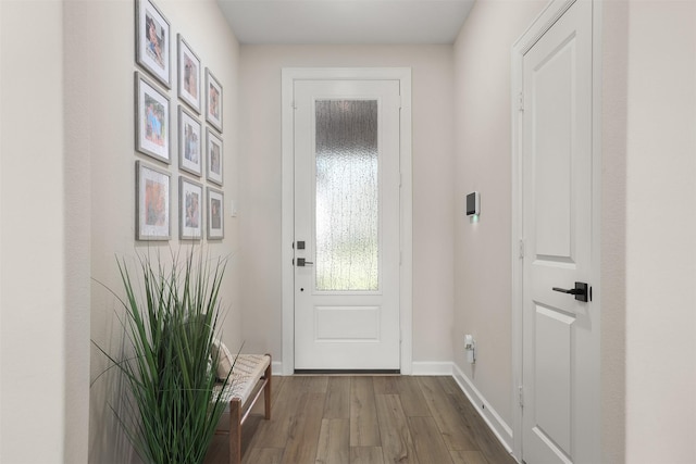 13709 Gaff Rig Dr, Texas City, TX 77510 - doorway featuring wood finished floors and baseboards
