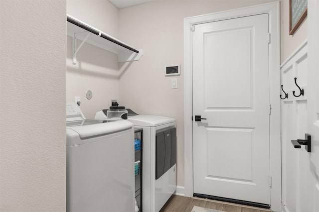 13709 Gaff Rig Dr, Texas City, TX 77510 - washroom featuring washer and clothes dryer and wood finished floors