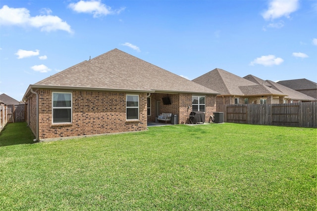 13709 Gaff Rig Dr, Texas City, TX 77510 - rear view of house featuring a fenced backyard, brick siding, a shingled roof, and a patio