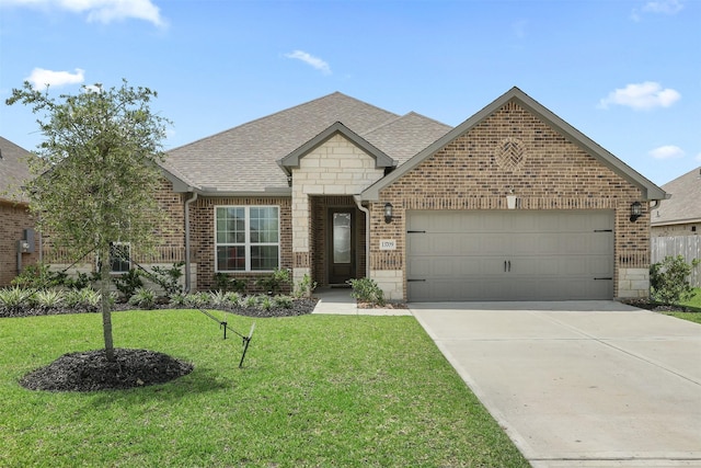 13709 Gaff Rig Dr, Texas City, TX 77510 - french country home with brick siding, a garage, a front lawn, a shingled roof, and driveway