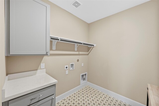 21726 Grayson Highlands Way, Porter, TX 77365 - washroom featuring cabinet space, hookup for an electric dryer, washer hookup, light floors, and gas dryer hookup