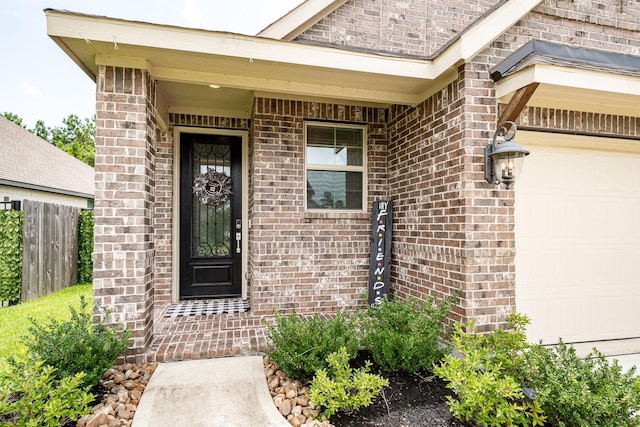 4327 Camden Springs Trl, Porter, TX 77365 - view of exterior entry with a garage and brick siding