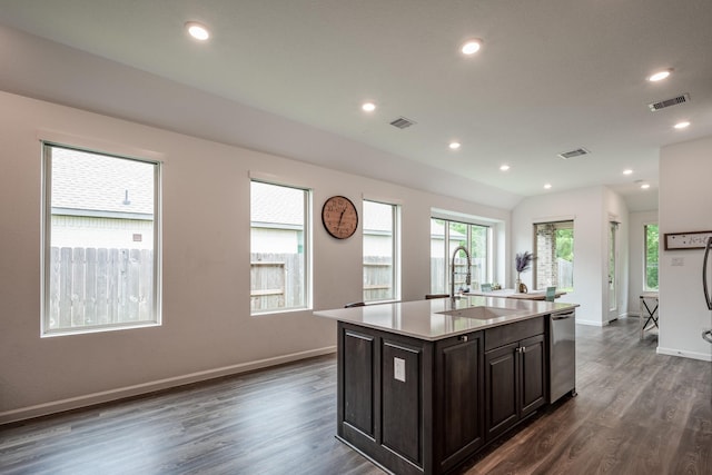 4327 Camden Springs Trl, Porter, TX 77365 - kitchen featuring dark wood-type flooring, light countertops, an island with sink, stainless steel dishwasher, and recessed lighting