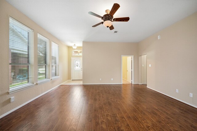2207 Highland Hills Dr, Conroe, TX 77304 - unfurnished living room with hardwood / wood-style flooring and a ceiling fan
