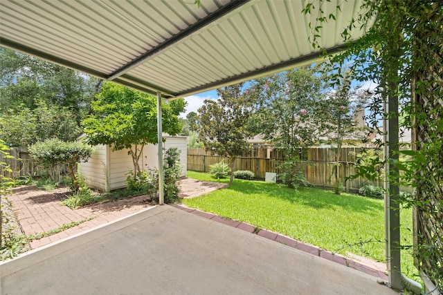 2207 Highland Hills Dr, Conroe, TX 77304 - fenced backyard with a patio and a storage shed