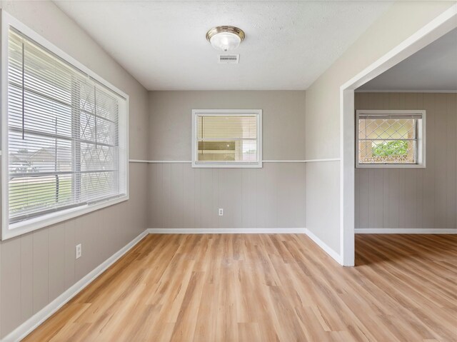 1705 Spruce St, Bay City, TX 77414 - unfurnished room featuring wood finished floors and wood walls