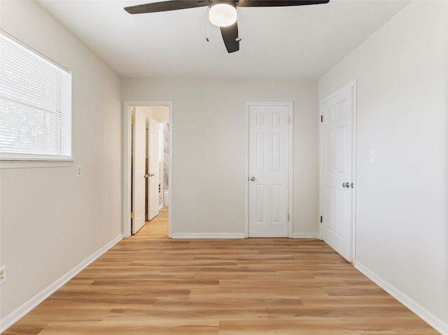 1705 Spruce St, Bay City, TX 77414 - unfurnished bedroom featuring light wood finished floors and ceiling fan
