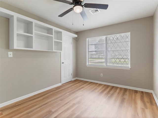 1705 Spruce St, Bay City, TX 77414 - empty room featuring light wood-style flooring and a ceiling fan