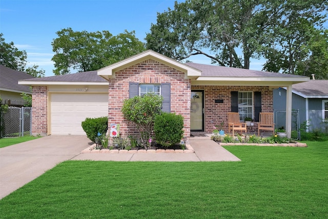 2222 3rd St, Rosenberg, TX 77471 - ranch-style house featuring brick siding, a garage, a front lawn, driveway, and covered porch