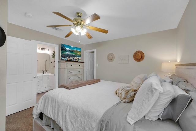 2222 3rd St, Rosenberg, TX 77471 - bedroom featuring carpet floors, a ceiling fan, and ensuite bath