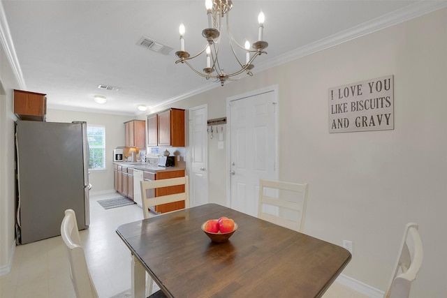 2222 3rd St, Rosenberg, TX 77471 - dining room with ornamental molding and a chandelier