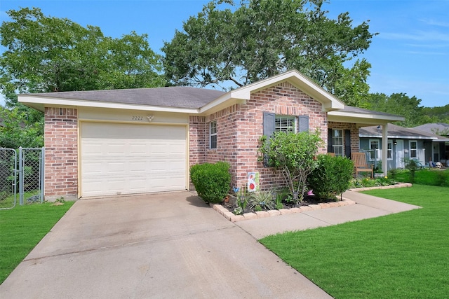 2222 3rd St, Rosenberg, TX 77471 - view of front of home featuring brick siding, concrete driveway, and a garage