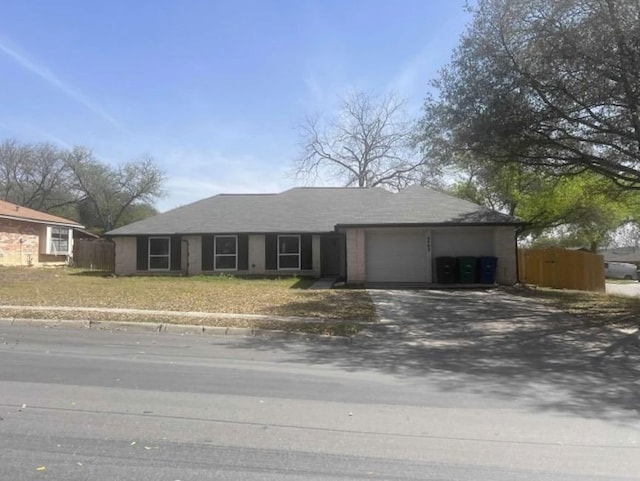 6402 Green Top Dr, San Antonio, TX 78233 - ranch-style house featuring dirt driveway and an attached garage