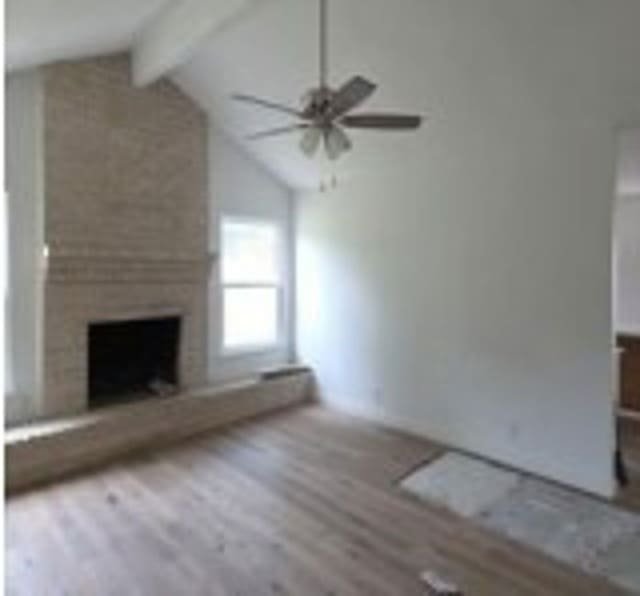 6402 Green Top Dr, San Antonio, TX 78233 - unfurnished living room featuring wood finished floors, a ceiling fan, and a large fireplace