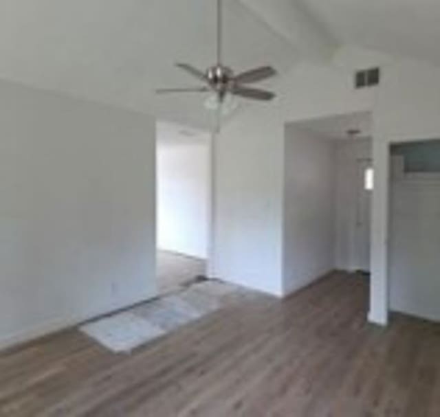 6402 Green Top Dr, San Antonio, TX 78233 - unfurnished living room featuring vaulted ceiling, a ceiling fan, and wood finished floors