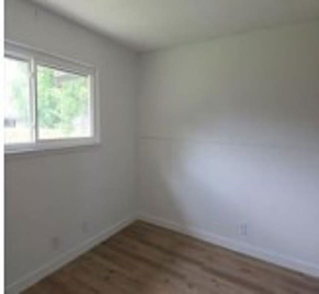 6402 Green Top Dr, San Antonio, TX 78233 - empty room with wood finished floors and baseboards