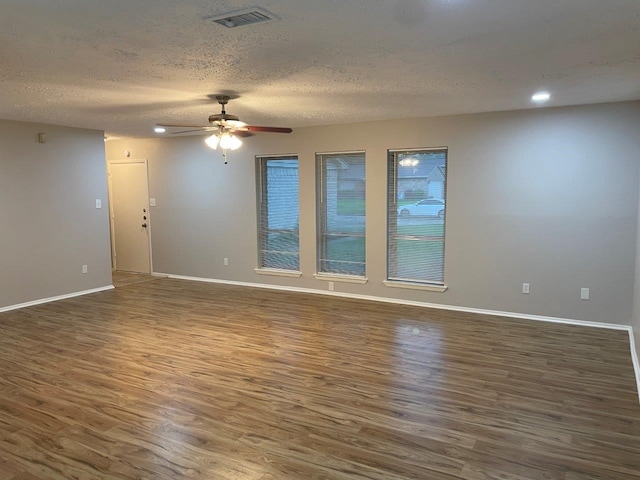 14207 Montaigne Dr, Cypress, TX 77429 - unfurnished room with wood finished floors, a textured ceiling, ceiling fan, and recessed lighting