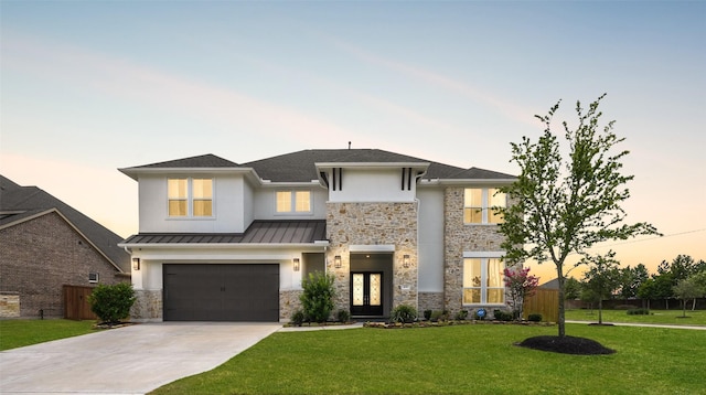 400 Horizon Light Ln, Katy, TX 77493 - view of front of house featuring french doors, driveway, stone siding, an attached garage, and a standing seam roof