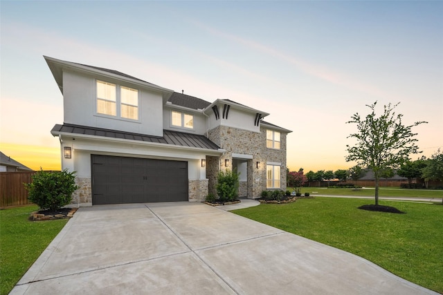 400 Horizon Light Ln, Katy, TX 77493 - view of front of house with stone siding, a standing seam roof, concrete driveway, and an attached garage