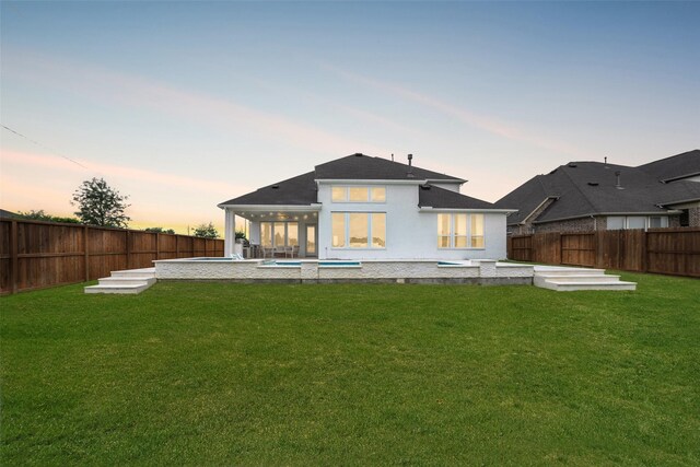 400 Horizon Light Ln, Katy, TX 77493 - back of house at dusk featuring a fenced backyard