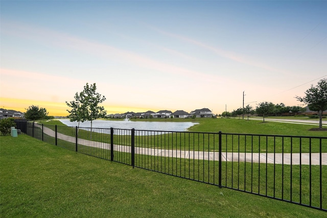 400 Horizon Light Ln, Katy, TX 77493 - yard at dusk with a water view and a residential view