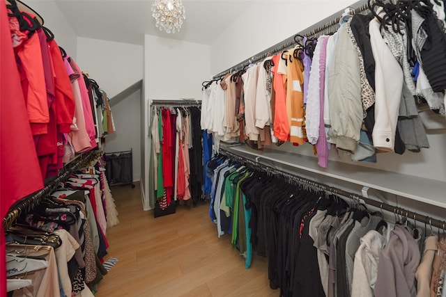 400 Horizon Light Ln, Katy, TX 77493 - walk in closet with wood finished floors and a chandelier