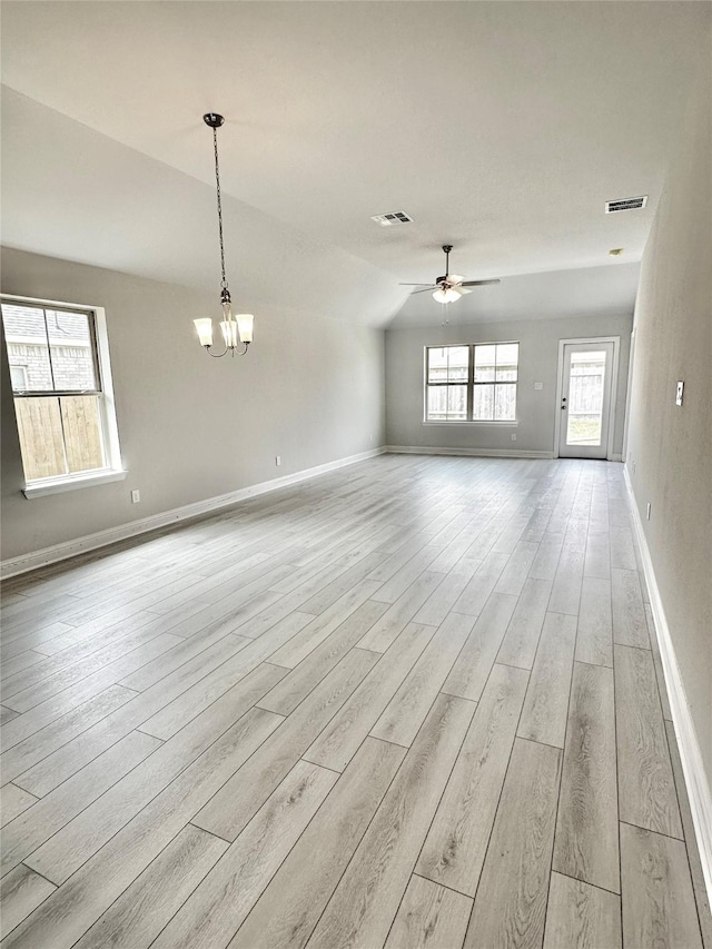 4301 Fenwick Rd, Texas City, TX 77591 - unfurnished room featuring light wood-type flooring, a ceiling fan, a chandelier, and vaulted ceiling