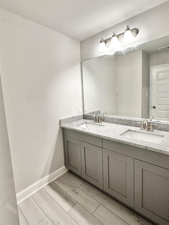 4301 Fenwick Rd, Texas City, TX 77591 - full bath with double vanity and wood finish floors
