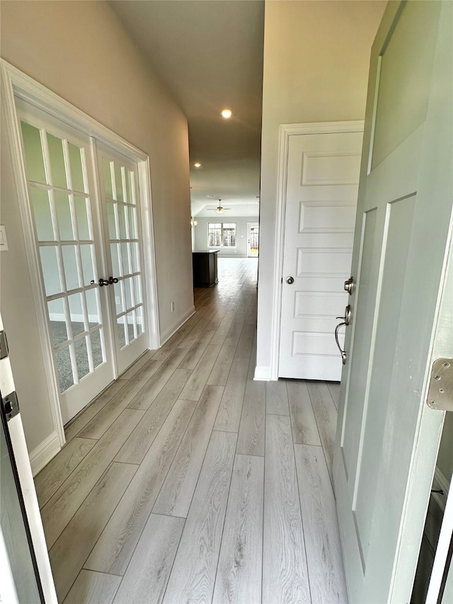 4301 Fenwick Rd, Texas City, TX 77591 - hallway with light wood finished floors, french doors, and recessed lighting