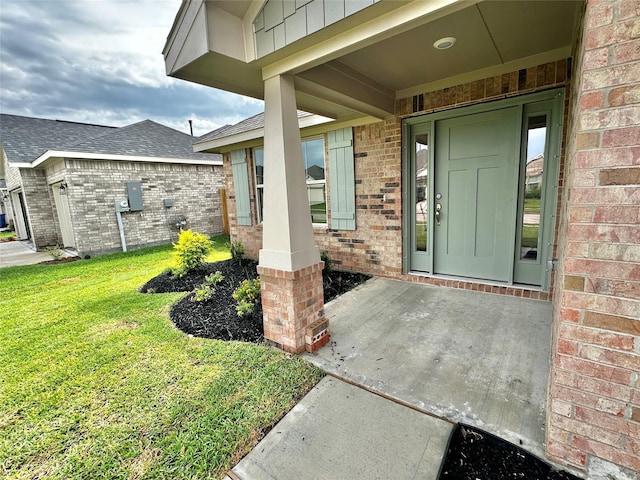 4301 Fenwick Rd, Texas City, TX 77591 - doorway to property featuring brick siding, a yard, and roof with shingles