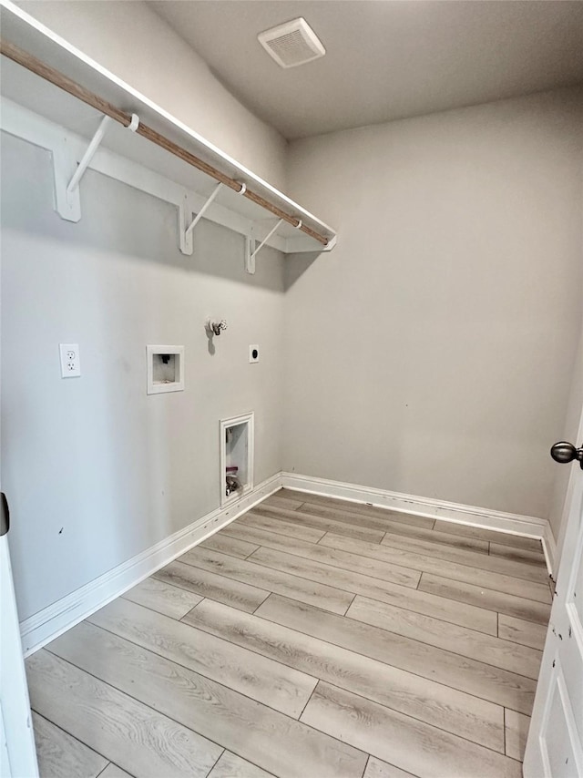 4301 Fenwick Rd, Texas City, TX 77591 - laundry room with electric dryer hookup, light wood-type flooring, and hookup for a washing machine