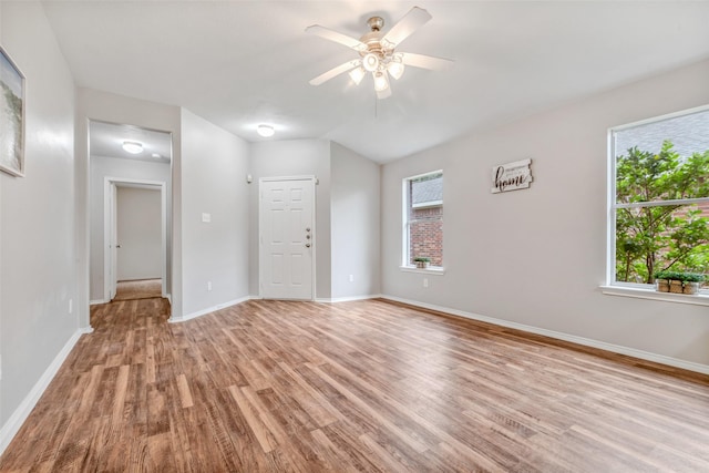 20806 Dewberry Creek Ln, Katy, TX 77449 - empty room with light wood-style floors, healthy amount of natural light, and ceiling fan