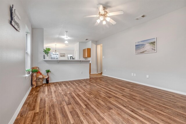 20806 Dewberry Creek Ln, Katy, TX 77449 - unfurnished living room with wood finished floors and a ceiling fan
