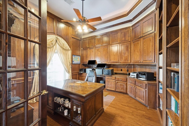 16919 Storybrook Forest Dr, Tomball, TX 77377 - office featuring a ceiling fan, light wood finished floors, crown molding, and wooden walls