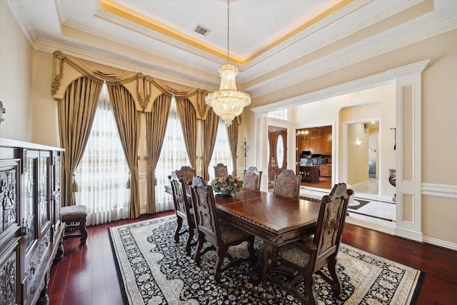 16919 Storybrook Forest Dr, Tomball, TX 77377 - dining room featuring a chandelier, ornamental molding, wood finished floors, and a tray ceiling