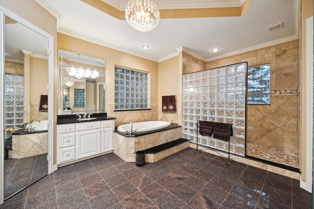 16919 Storybrook Forest Dr, Tomball, TX 77377 - bathroom with a chandelier, a bath, tile walls, vanity, and walk in shower