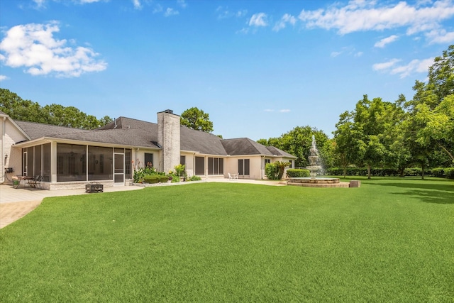16919 Storybrook Forest Dr, Tomball, TX 77377 - back of property with a sunroom, a lawn, and a chimney