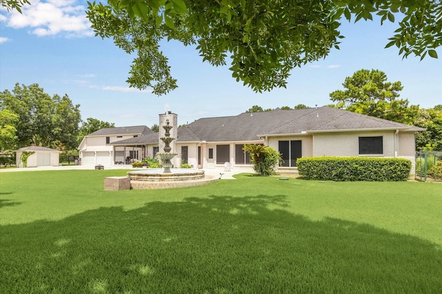 16919 Storybrook Forest Dr, Tomball, TX 77377 - rear view of house featuring a lawn, a chimney, an outbuilding, and a garage