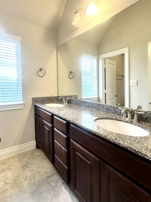29018 Pinnacle Ridge Dr, Katy, TX 77494 - full bathroom featuring lofted ceiling, double vanity, and tile patterned flooring
