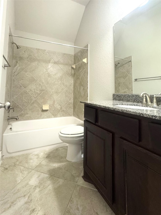 29018 Pinnacle Ridge Dr, Katy, TX 77494 - full bathroom with washtub / shower combination, vanity, lofted ceiling, and a textured wall
