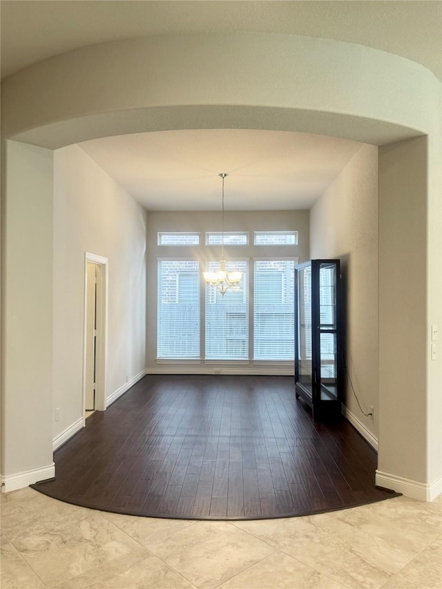 29018 Pinnacle Ridge Dr, Katy, TX 77494 - unfurnished dining area with a chandelier and hardwood / wood-style floors